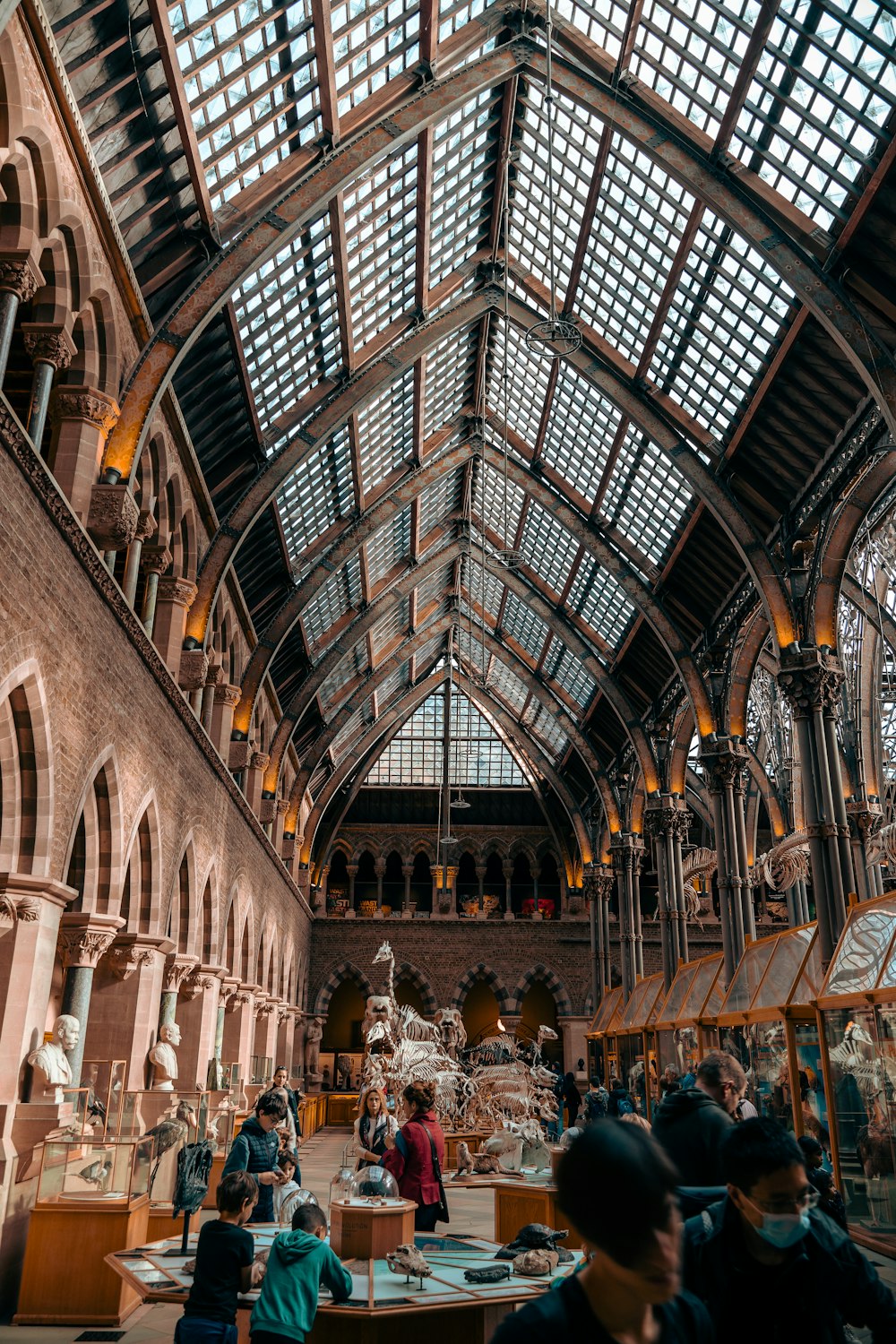 a large room with many people in it with Leadenhall Market in the background