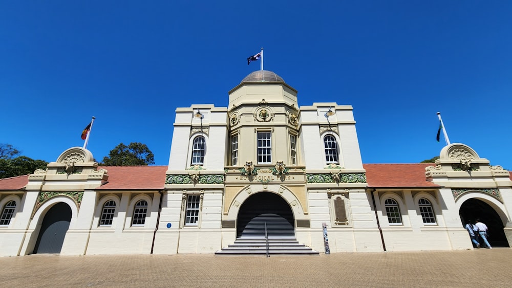 a large white building with a clock tower