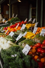 a bunch of vegetables and fruits at a market
