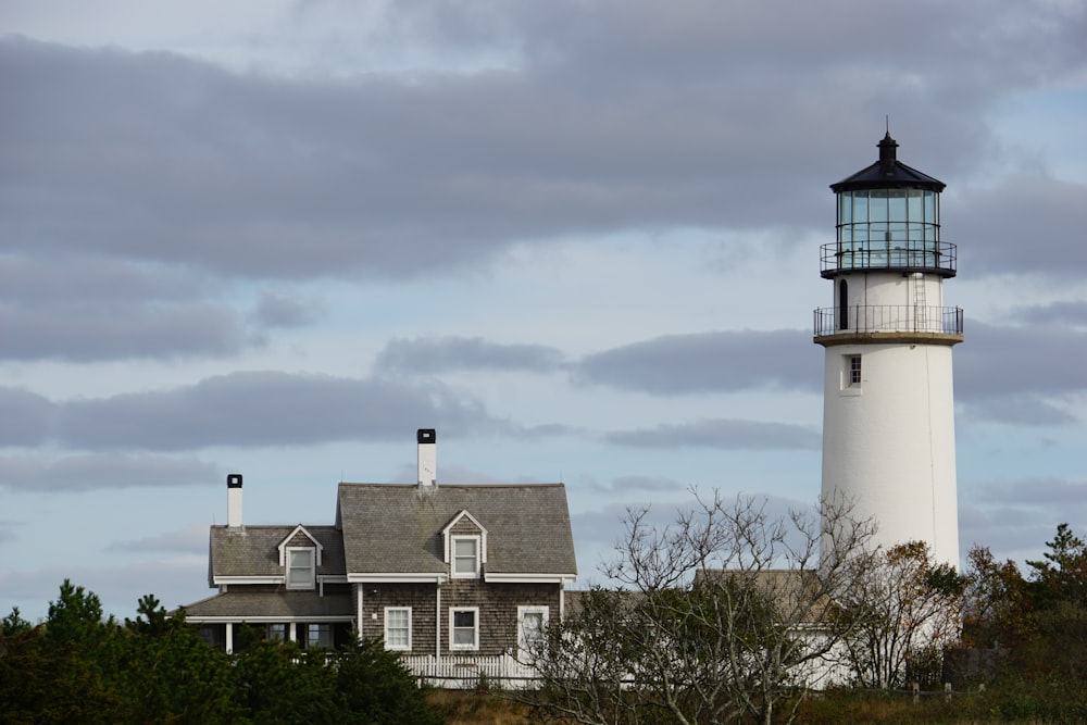 a lighthouse and a house