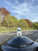 A sleek scale model of a popular gaming character showcased on a minimalist shelf.