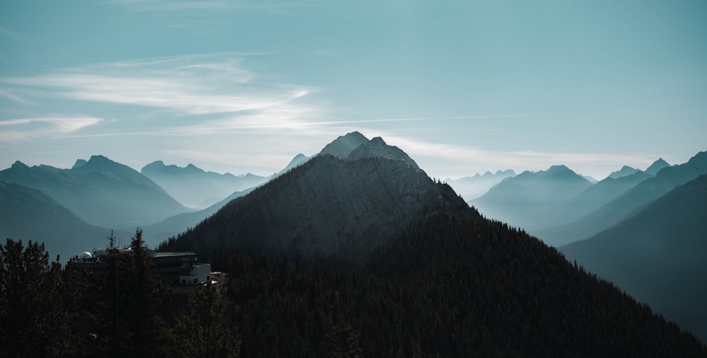 a mountain with trees and buildings