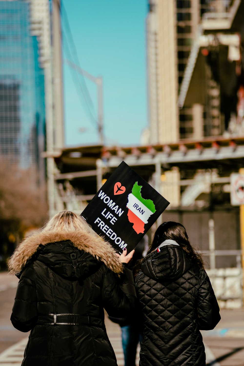 a couple of people holding signs