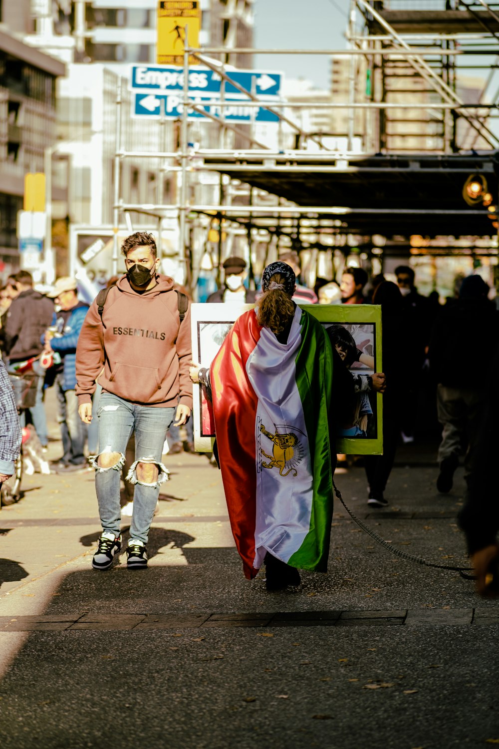 a person walking with a person in a garment