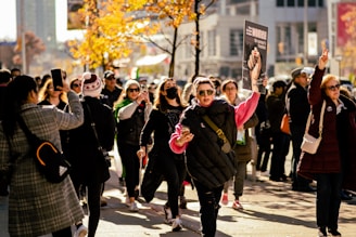 a group of people walking down a street