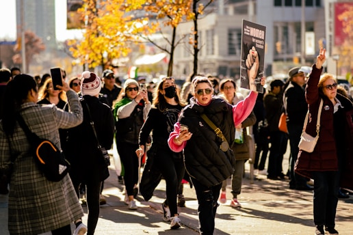 a group of people walking down a street