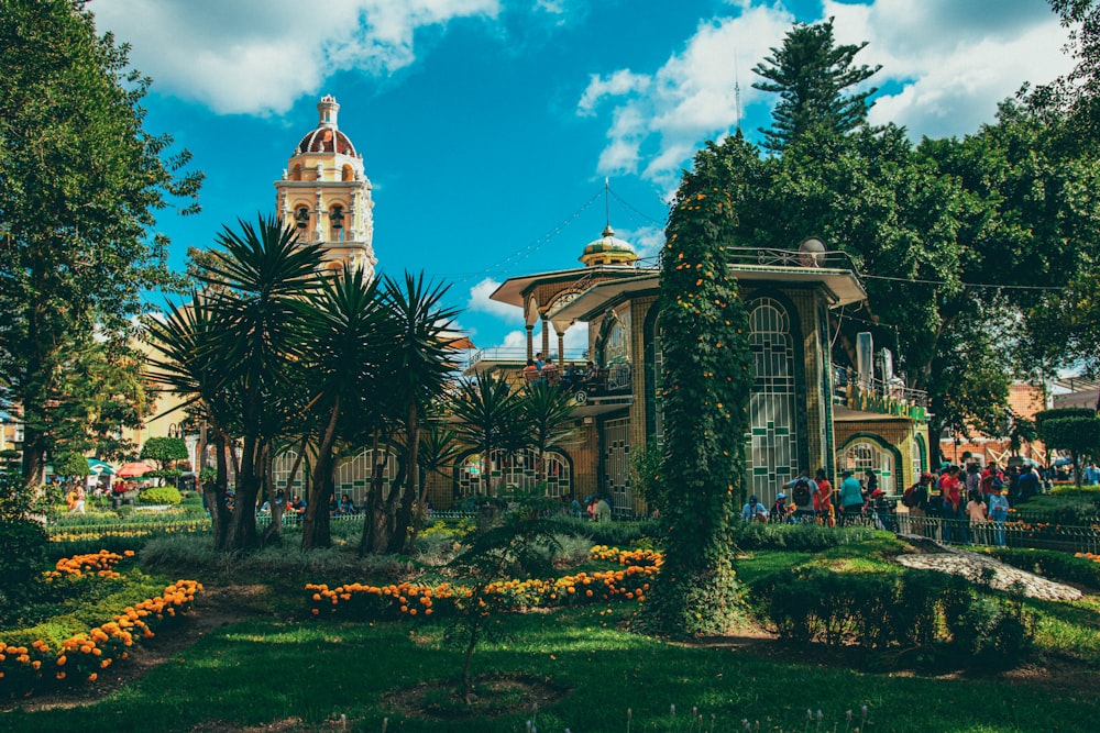 a building with a dome and trees in front of it