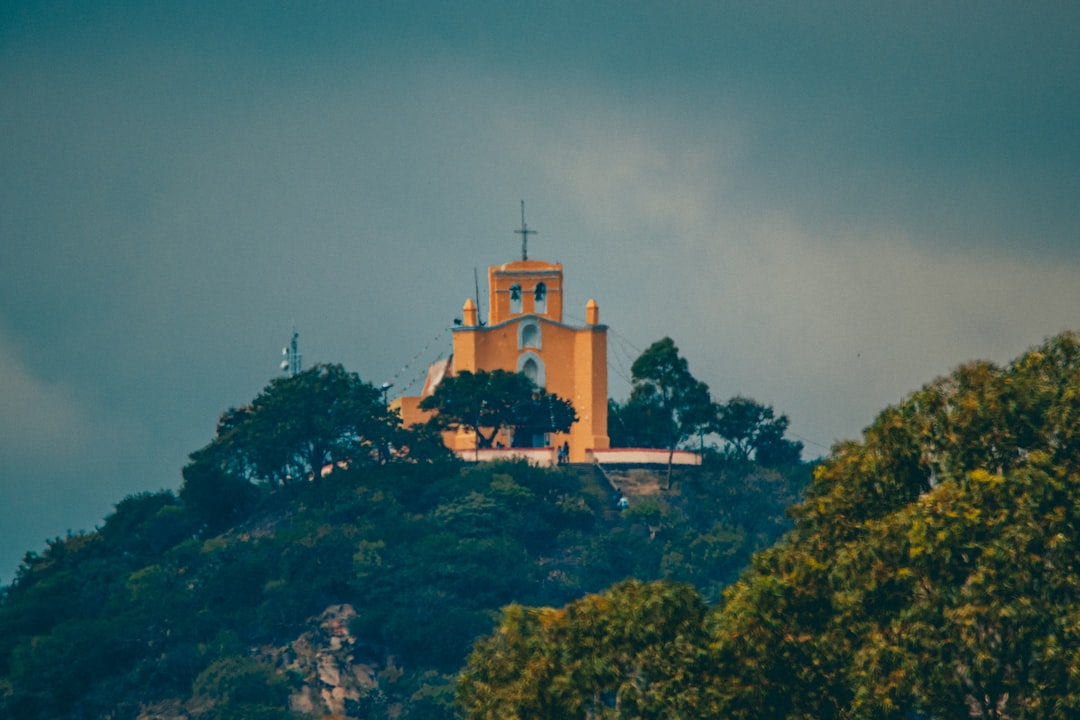 a building on a hill,