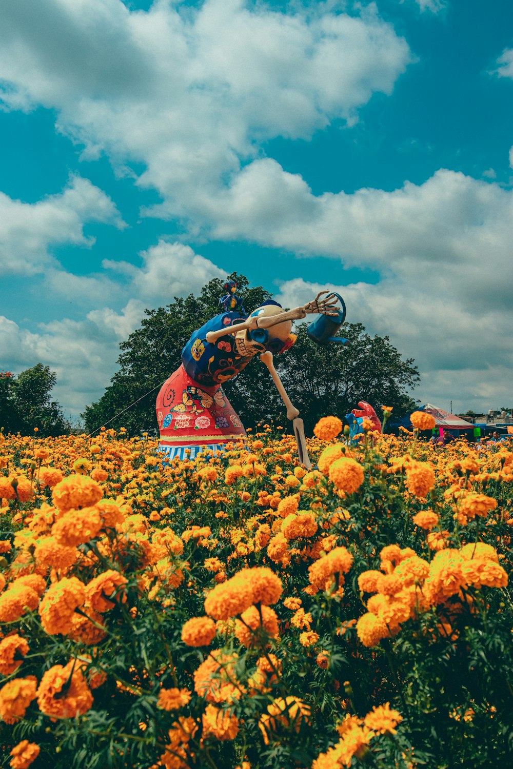 a person jumping in a field of flowers