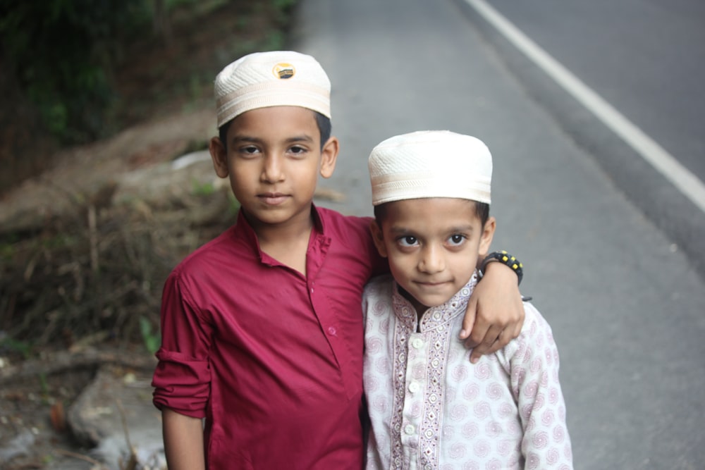 a couple of children posing for the camera