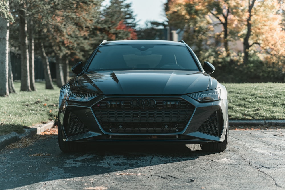 a black car parked on a road