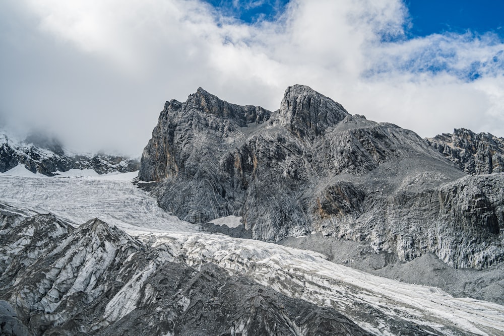 a rocky mountain with snow