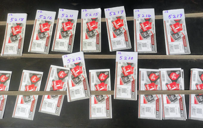 Organized service tickets and QR codes ready for customer pickup