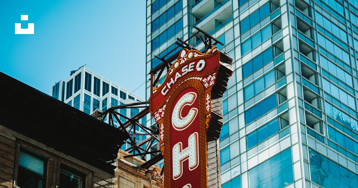 A large red sign in front of a building photo – Free Wallpaper Image on ...