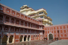a large red building with City Palace, Jaipur in the background