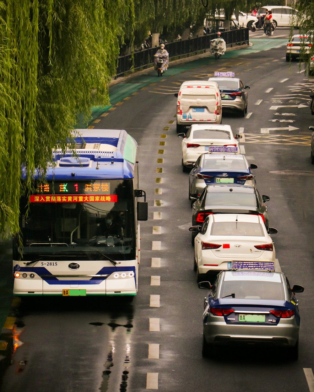 a double decker bus driving down the street