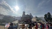 A panoramic shot of the scenic Sankat Mochan Hanuman Temple surrounded by devotees.