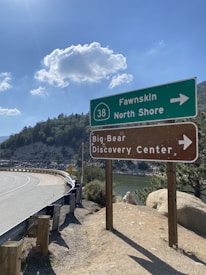 Local businesses proudly displaying discount signs for Big Bear Lake Family Club Card members.