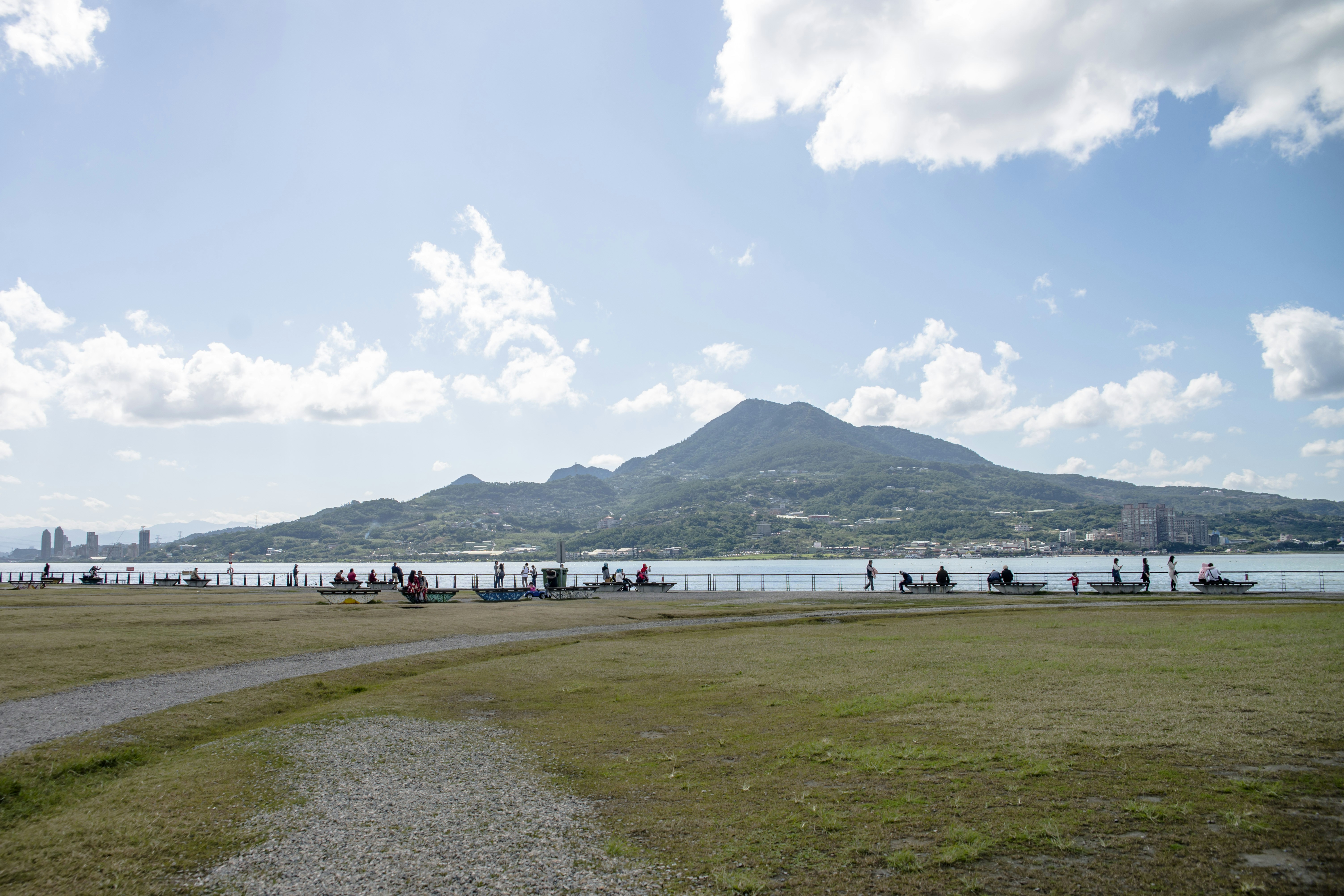 a body of water with a mountain in the background