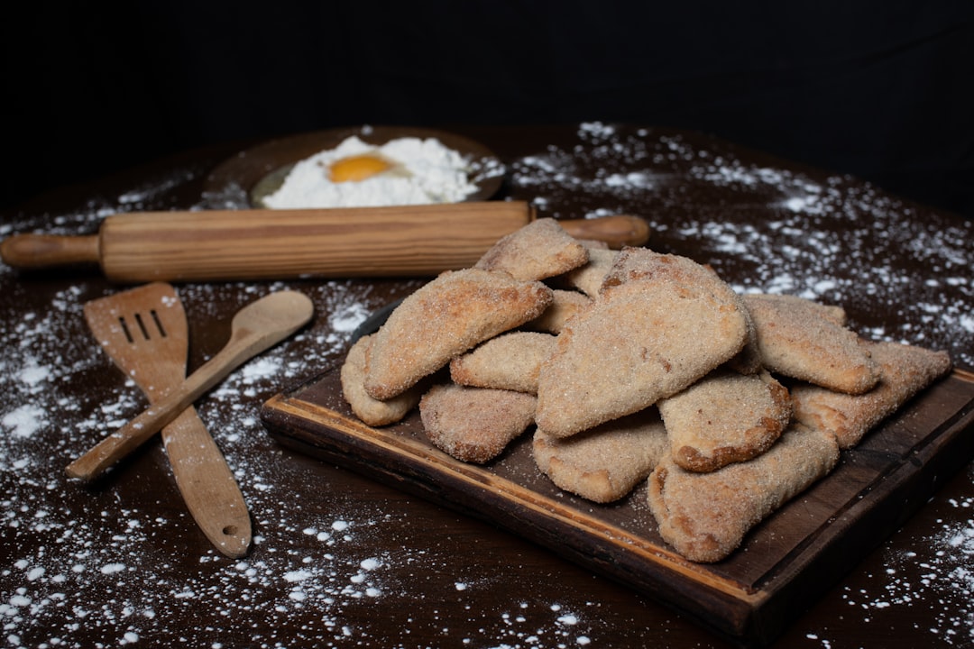 a group of wooden sticks with food on them,