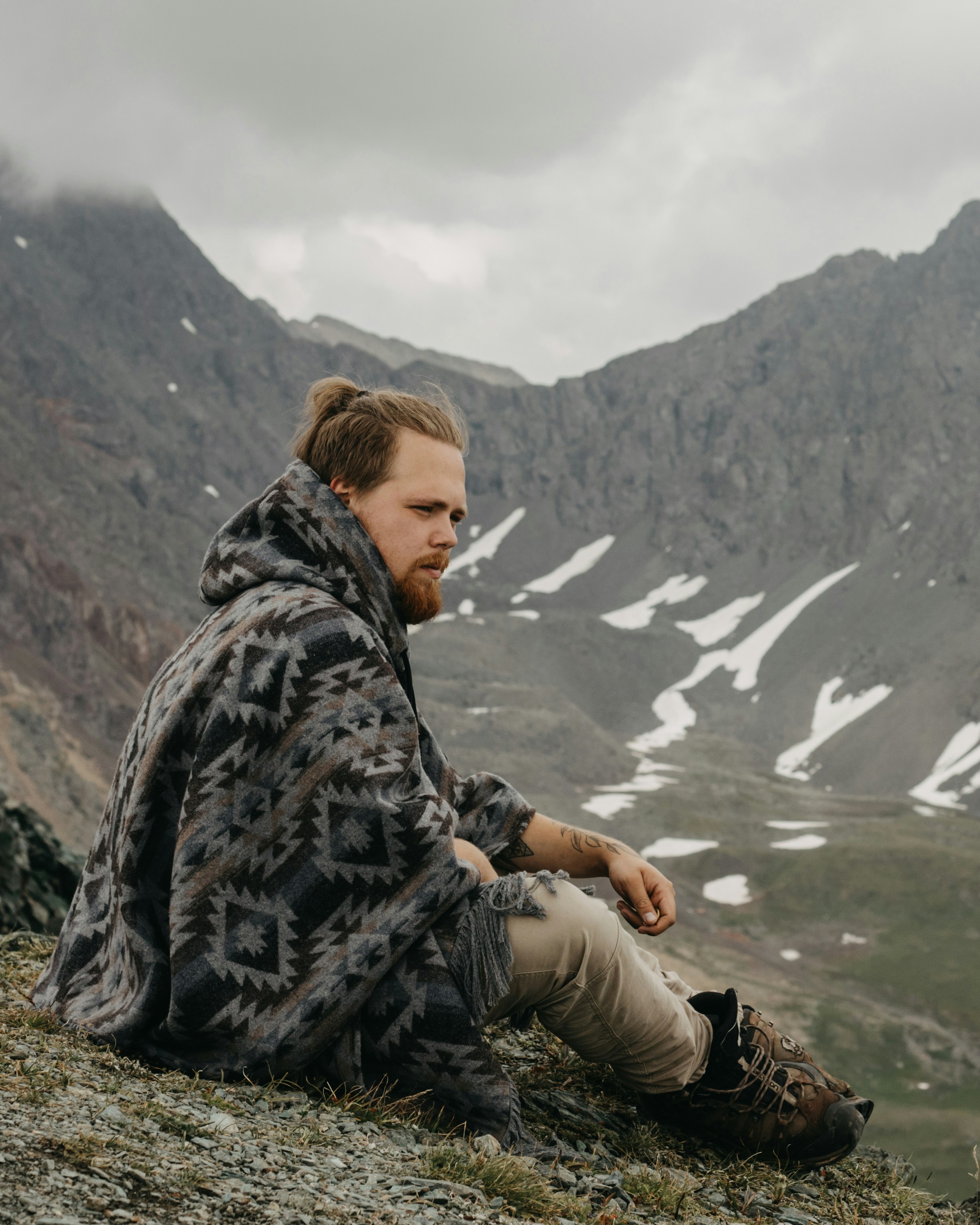 a man sitting on a mountain