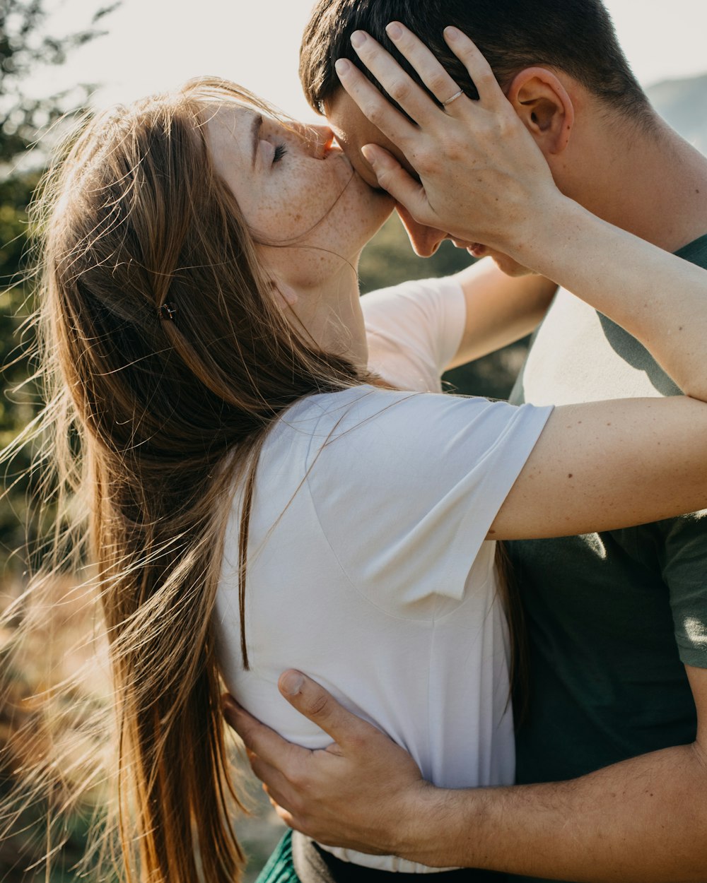 a man and woman kissing