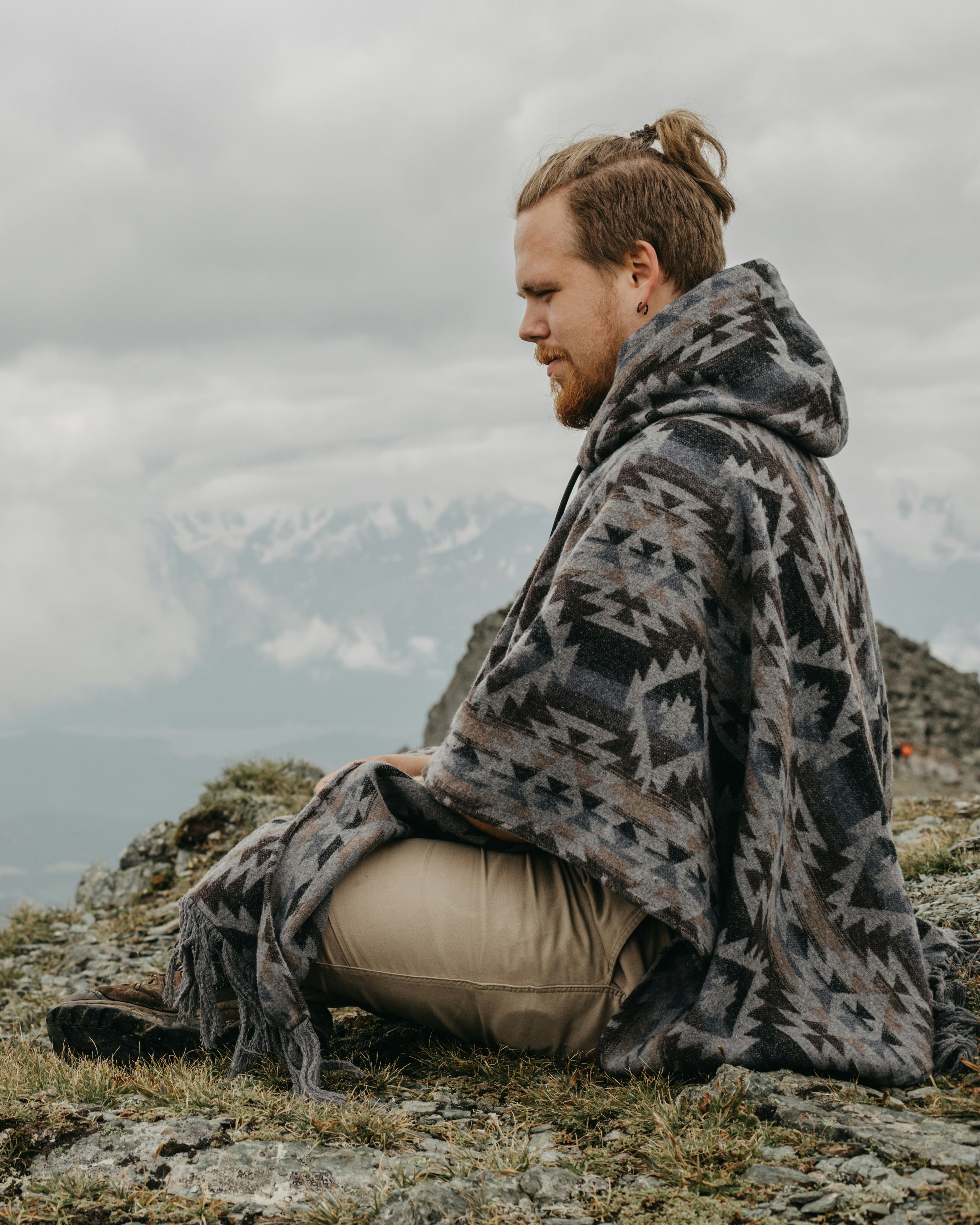 a man sitting on a rock