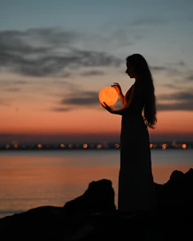 a man holding a pumpkin