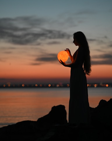 a man holding a pumpkin