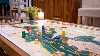a table with a game board and game pieces on it