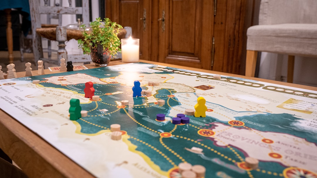 a table with a game board and game pieces on it,
