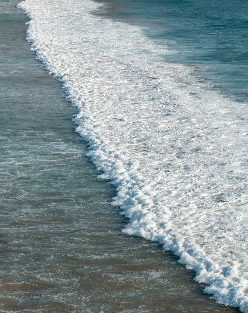 a body of water with waves