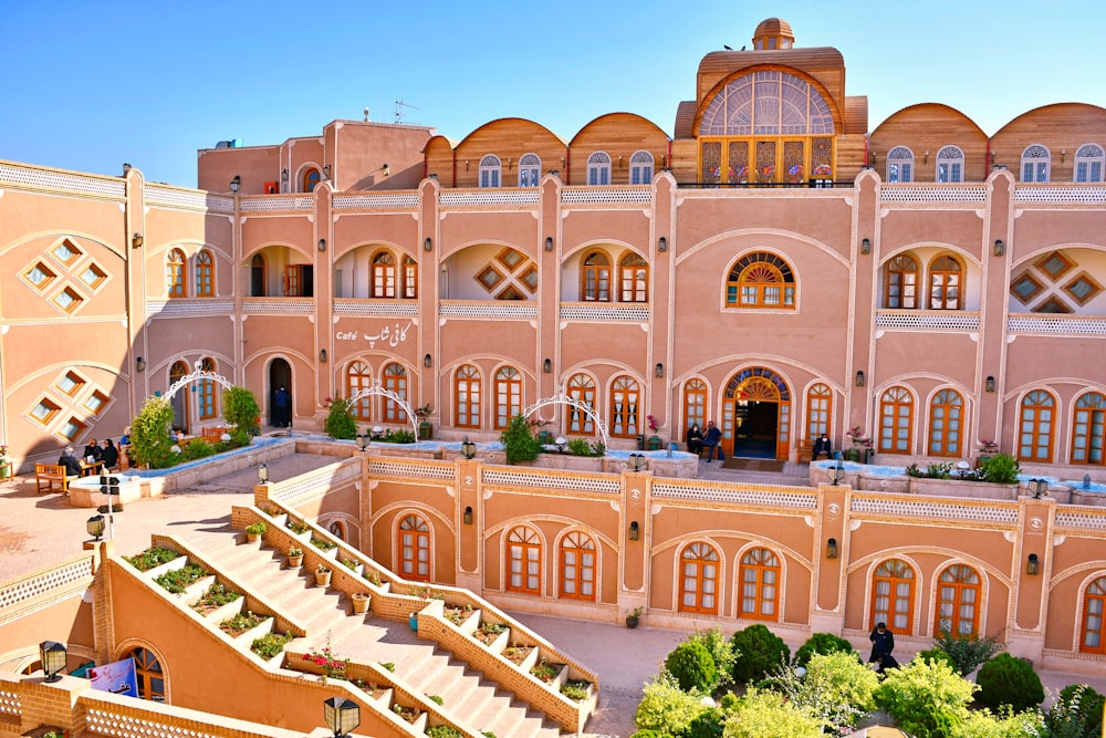 a large building with many windows with Hawa Mahal in the background