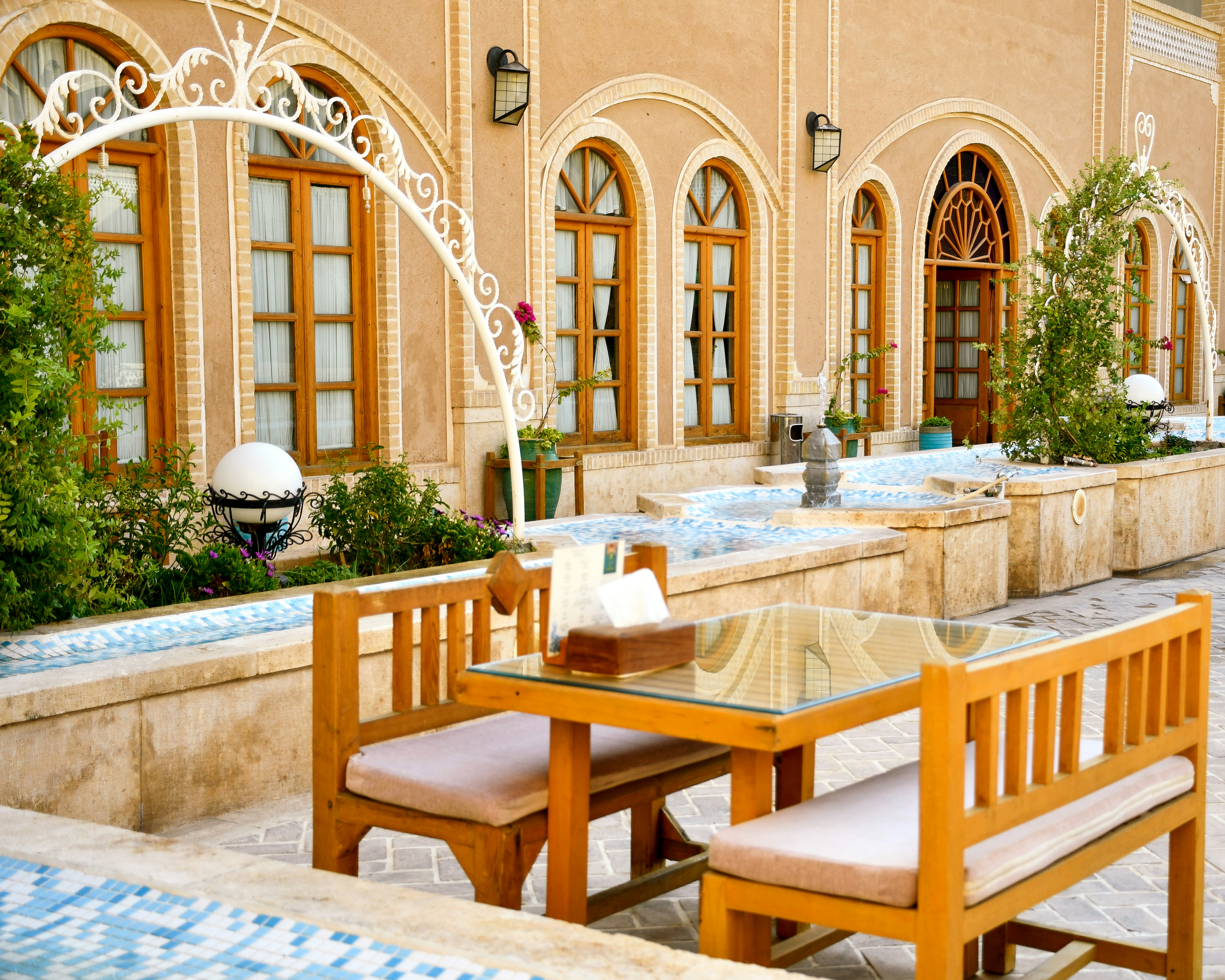a table and chairs outside a building