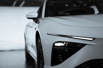 a white car with its front facing the camera