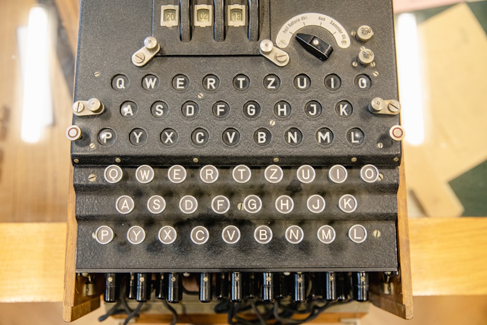 a black typewriter with many buttons