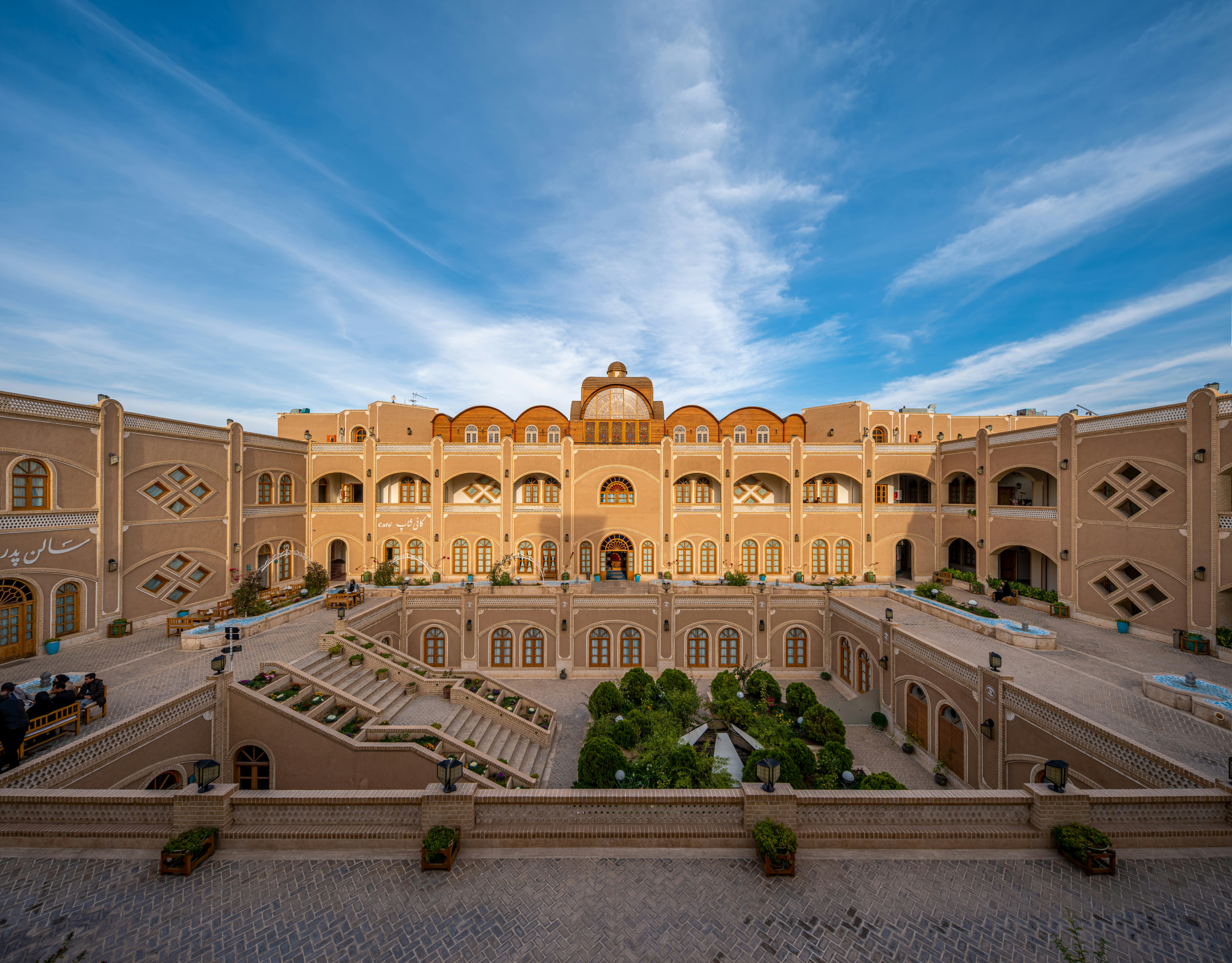 a large building with stairs and a courtyard