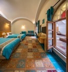 a room with a bed and a mirror