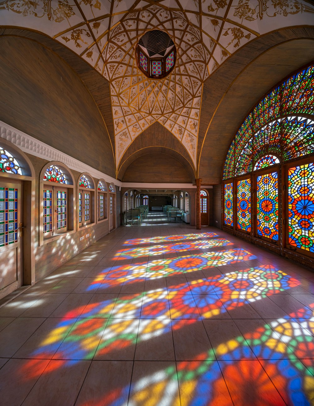a large room with stained glass windows