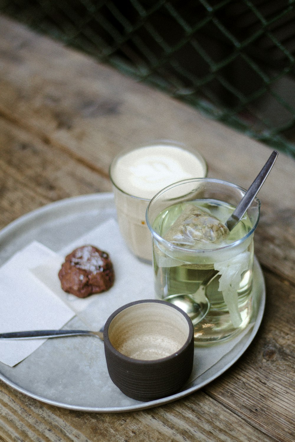 a plate with a dessert and a glass of milk on it