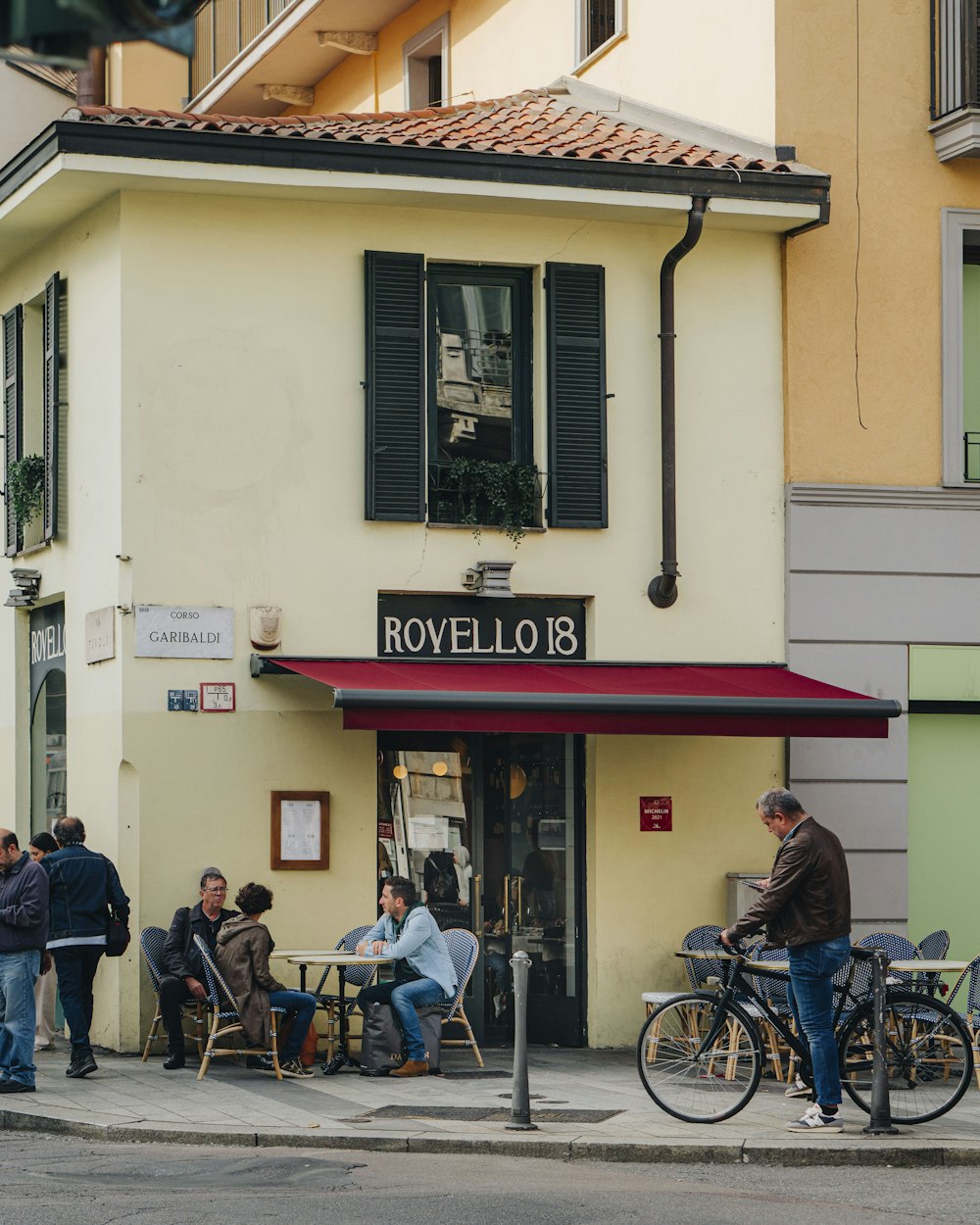 a group of people outside a restaurant