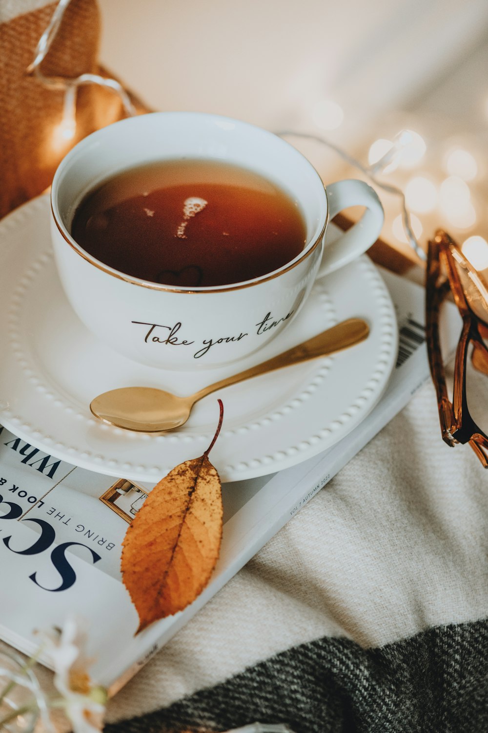 a cup of tea and a spoon