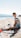 a man sitting on a beach