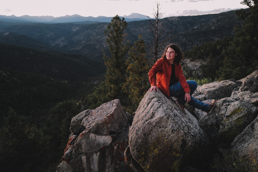 a man sitting on a rock