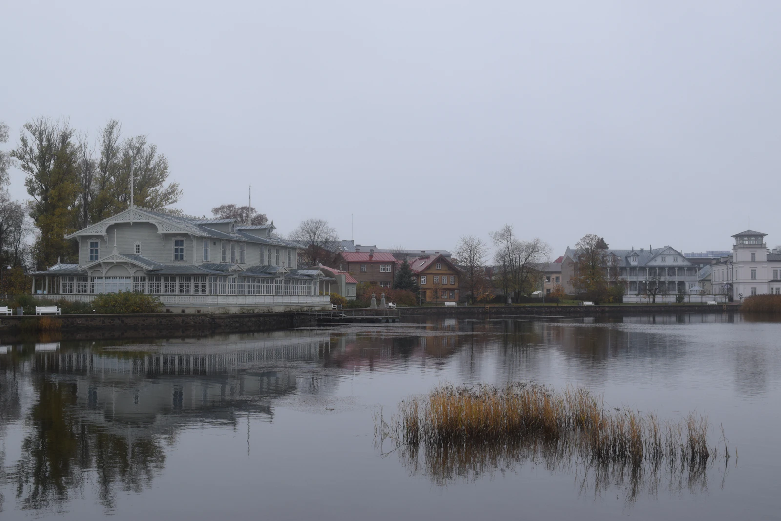 Reeds and wooden villas along the still water of Haapsalu bay