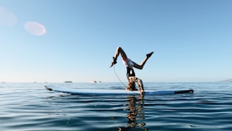 a man doing a flip into the water