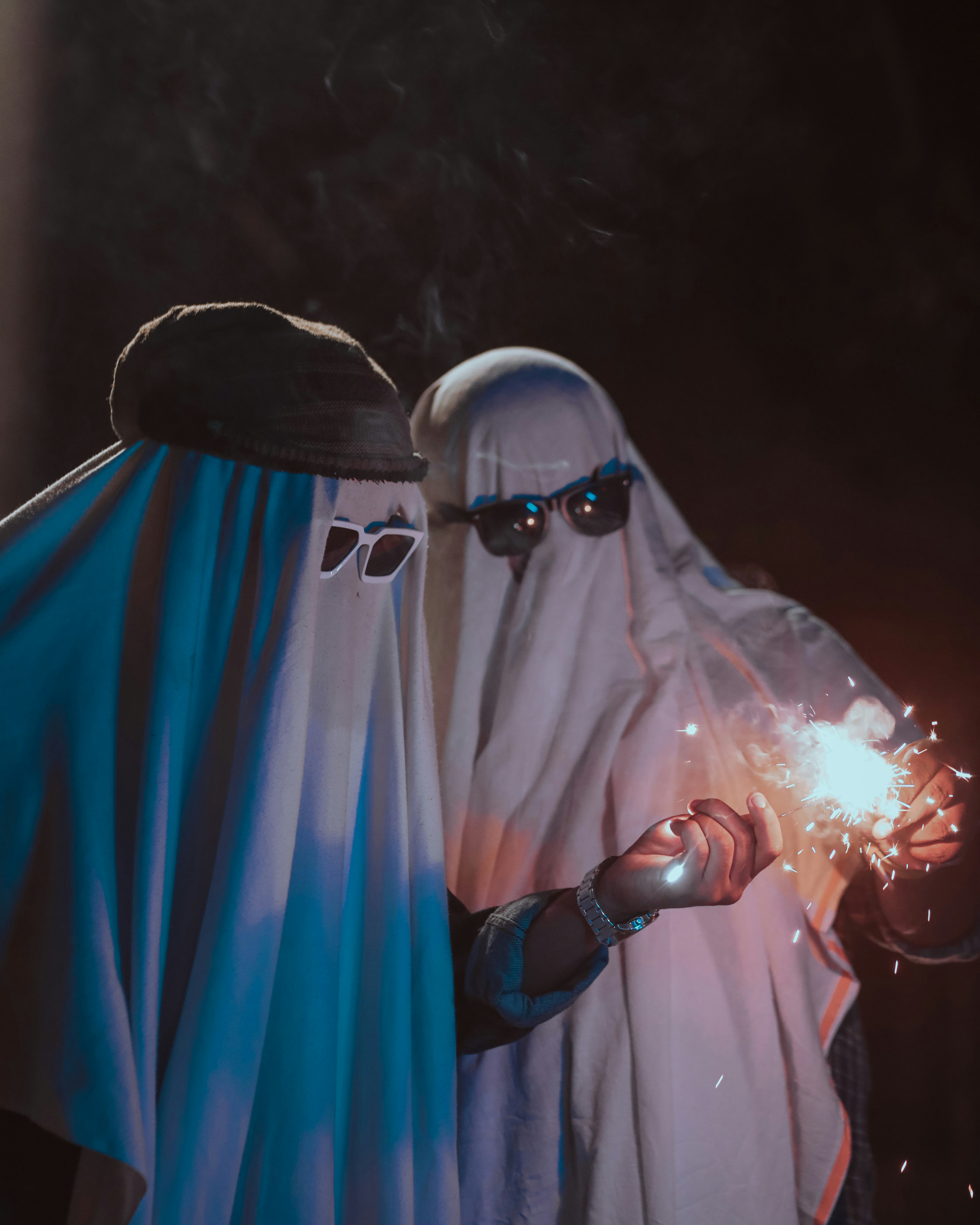 a person wearing a mask and holding a light saber