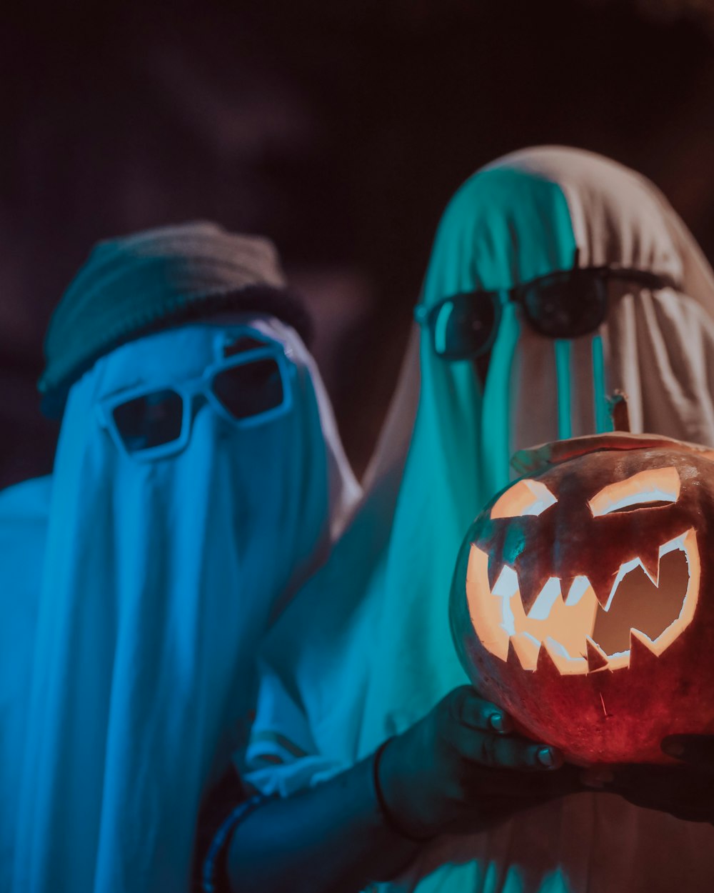 a person wearing a mask and holding a glass of beer