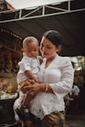 a person holding a baby