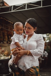 a person holding a baby